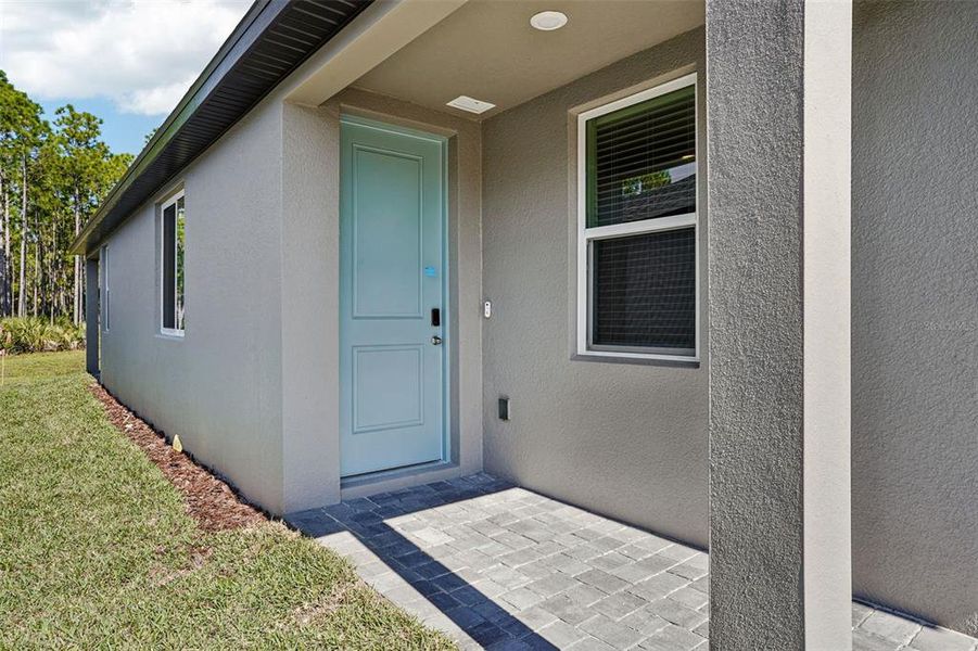 Exterior details and patio area of a home in Ridgehaven - Villas, Ormond Beach (Image 27).