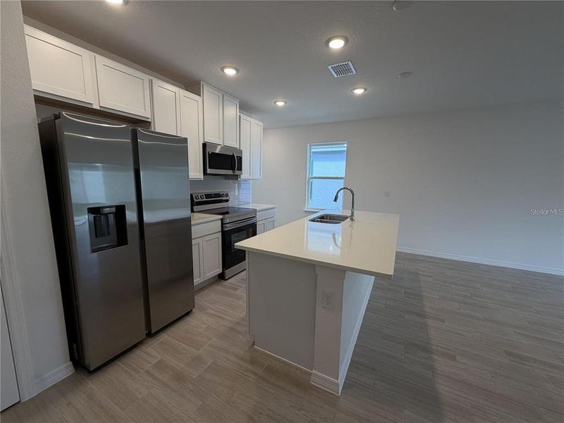 Furnished interior view inside a new home in Hammock Reserve, Haines City (Image 6).
