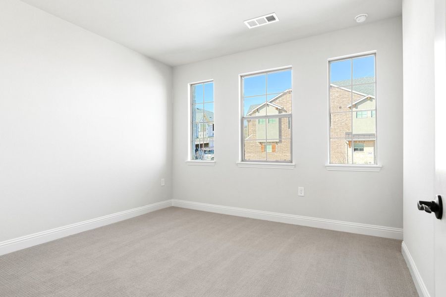 Spacious, unfurnished interior of a new home in The Tribute, The Colony (Image 41).