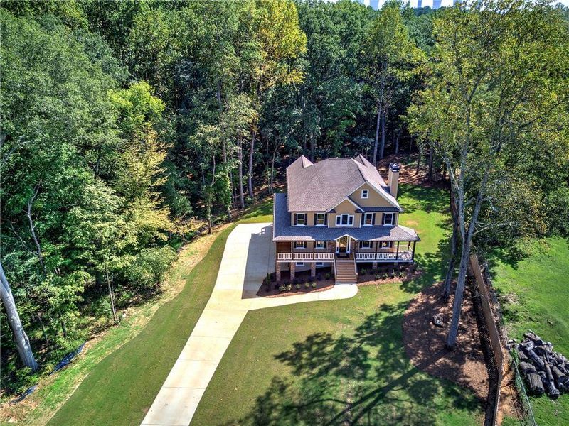 Front exterior of a new home in , Euharlee, GA, highlighting curb appeal (Image 1).