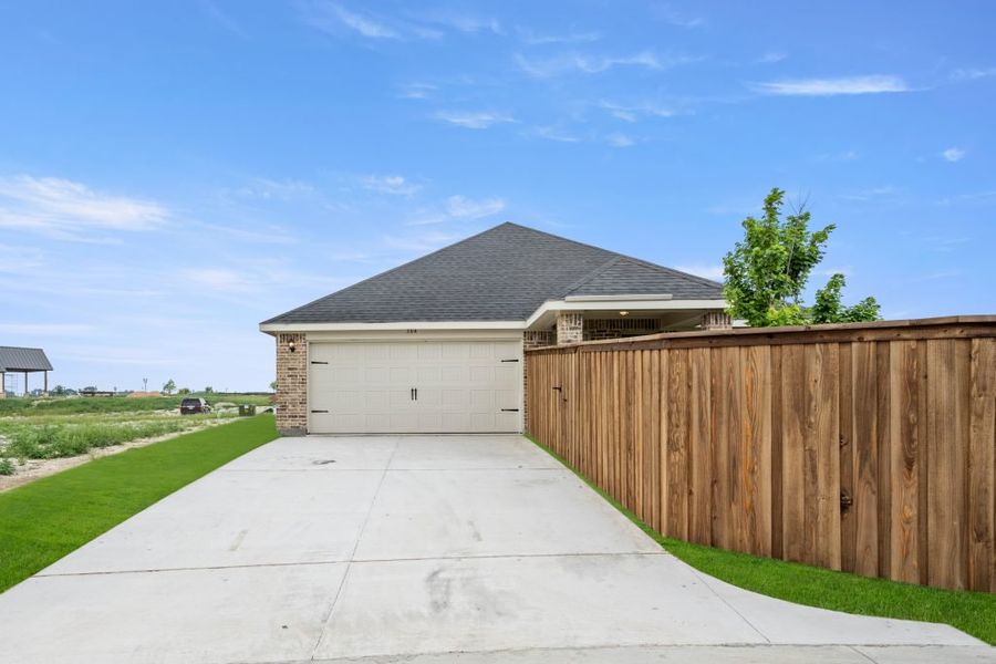 Representative exterior photo of a completed home built from the Jarvis by Impression Homes in Redden Farms, Midlothian, TX (Image 25).