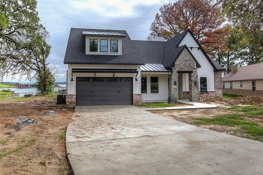 Front exterior of a new home in , Gun Barrel City, TX, highlighting curb appeal (Image 1). Front exterior of a new home in , Gun Barrel City, TX, highlighting curb appeal (Image 1).