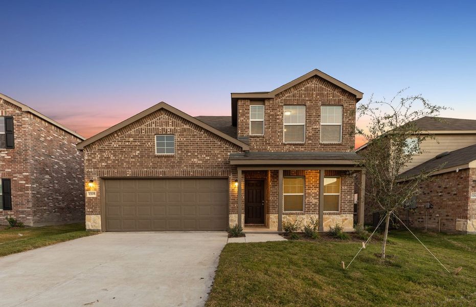 The Dinero, a one-story home with 2-car garage, shown with Home Exterior LS202