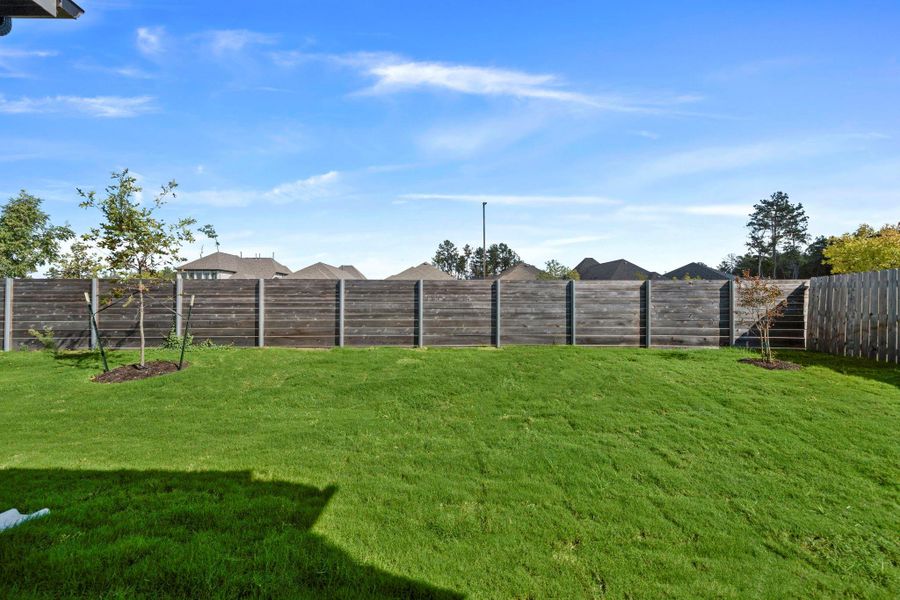 Exterior details and patio area of a home in Artavia, Conroe (Image 3).