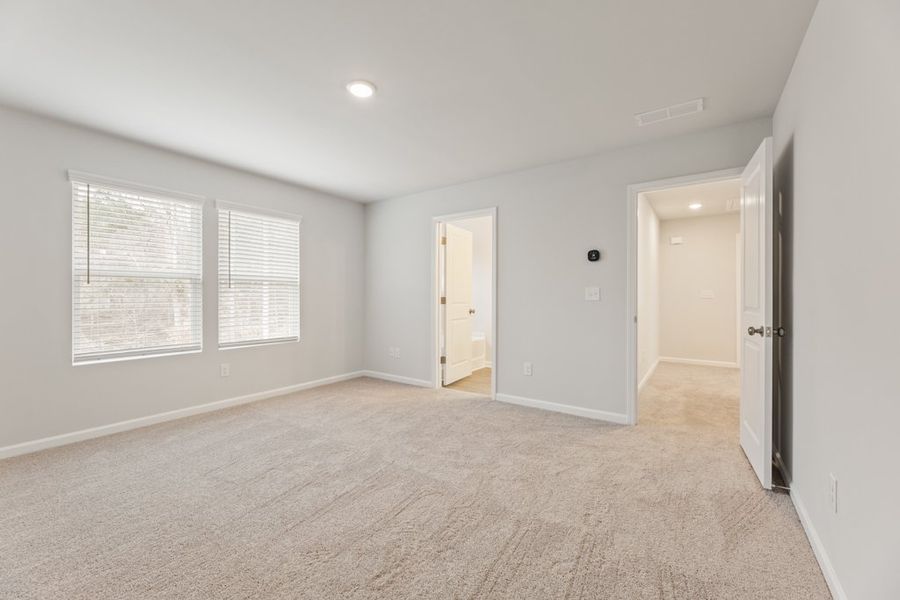 A hallway with white walls.