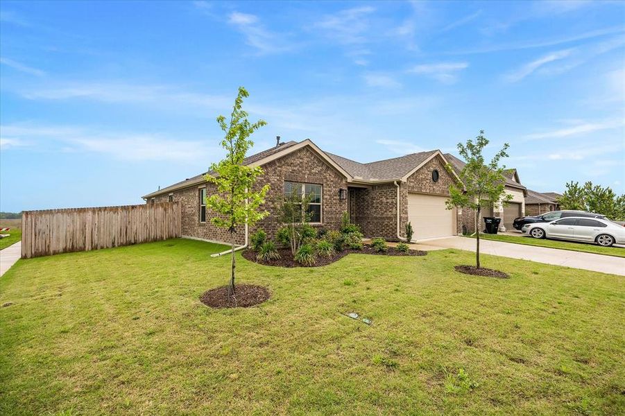 Front exterior of a new home in Fox Landing, Caddo Mills, TX, highlighting curb appeal (Image 25).