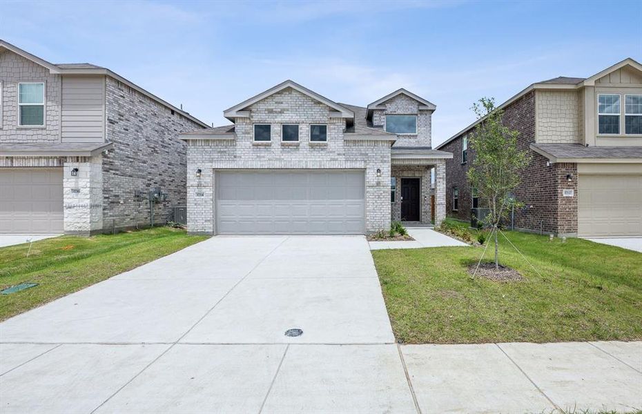 NEW CONSTRUCTION: Beautiful two-story home available at Arbordale in Forney *real home pictured