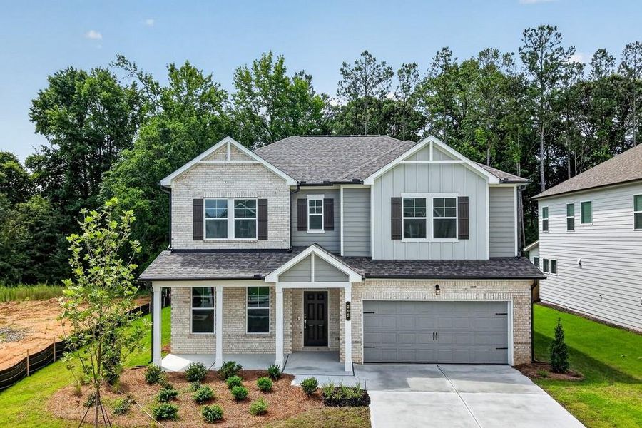 Front exterior of a new home in Bennett Farm, Loganville, GA, highlighting curb appeal (Image 1). Front exterior of a new home in Bennett Farm, Loganville, GA, highlighting curb appeal (Image 1).