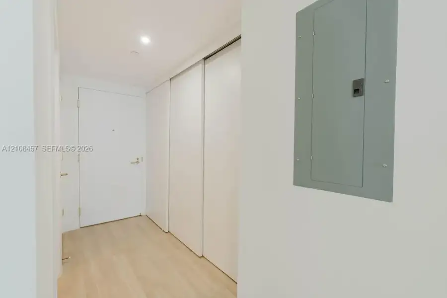 Wood-finish flooring, full-height sliding-door closet, and solid core entry door Wood-finish flooring, full-height sliding-door closet, and solid core entry door