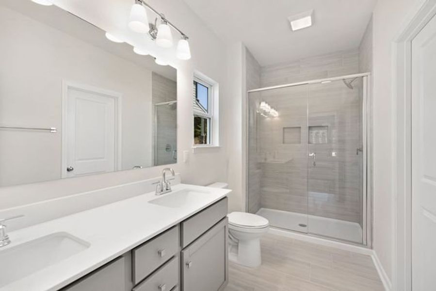 Representative furnished interior of a home built from the Shaw by True Homes in Whispering Hills, Locust (Image 8).