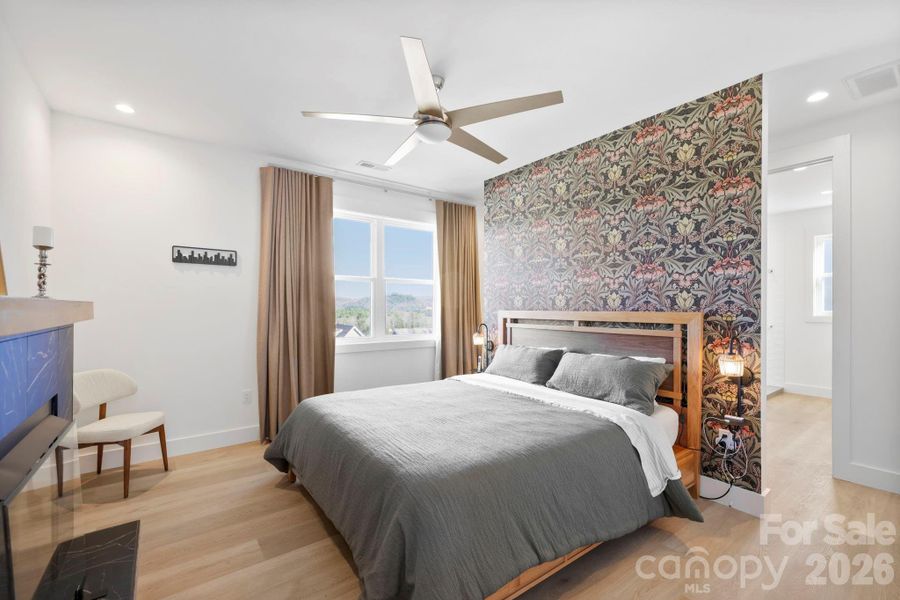 primary bedroom with privacy wall (closet and master bath behind)