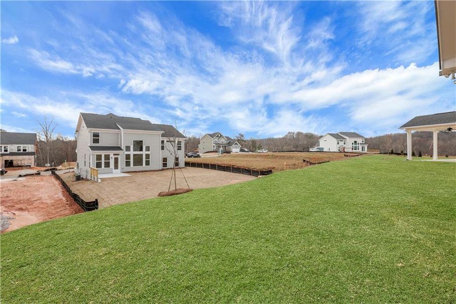 Exterior details and patio area of a home in Twin Lakes, Hoschton (Image 25).