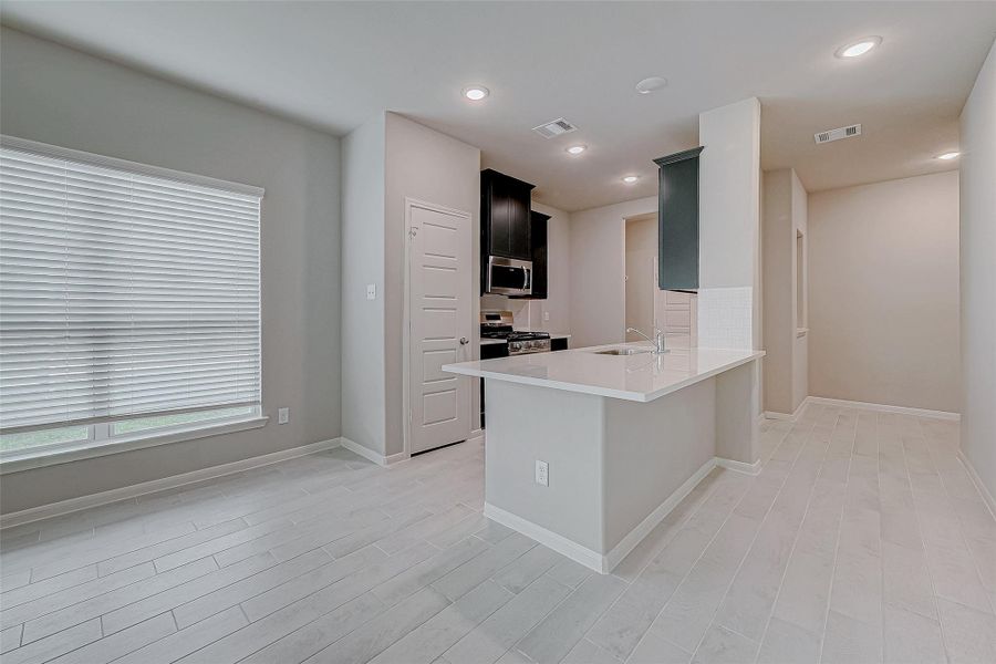 Furnished interior view inside a new home in Woodland Lakes, Huffman (Image 14).