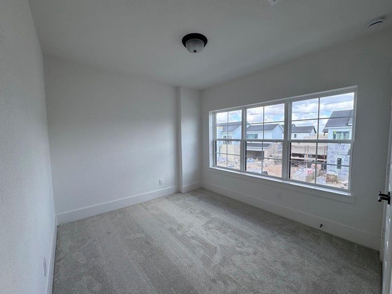 Spacious, unfurnished interior of a new home in Easthaven at Bridgeland Central - Vision Collection, Cypress (Image 13).