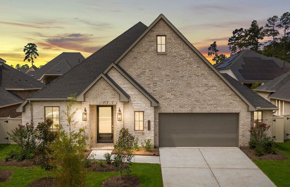 Front exterior of a new home in Audubon 60', Magnolia, TX, highlighting curb appeal (Image 1). Front exterior of a new home in Audubon 60', Magnolia, TX, highlighting curb appeal (Image 1).