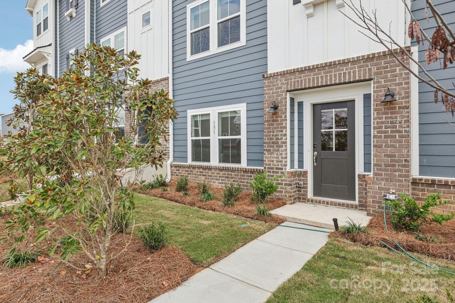 Exterior details and patio area of a home in Meadows at Wilson Farms - The Heights Series, Fort Mill (Image 1). Exterior details and patio area of a home in Meadows at Wilson Farms - The Heights Series, Fort Mill (Image 1).
