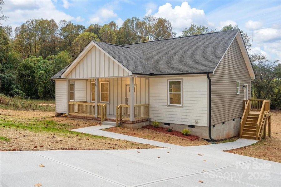 Front exterior of a new home in , Yadkinville, NC, highlighting curb appeal (Image 1). Front exterior of a new home in , Yadkinville, NC, highlighting curb appeal (Image 1).
