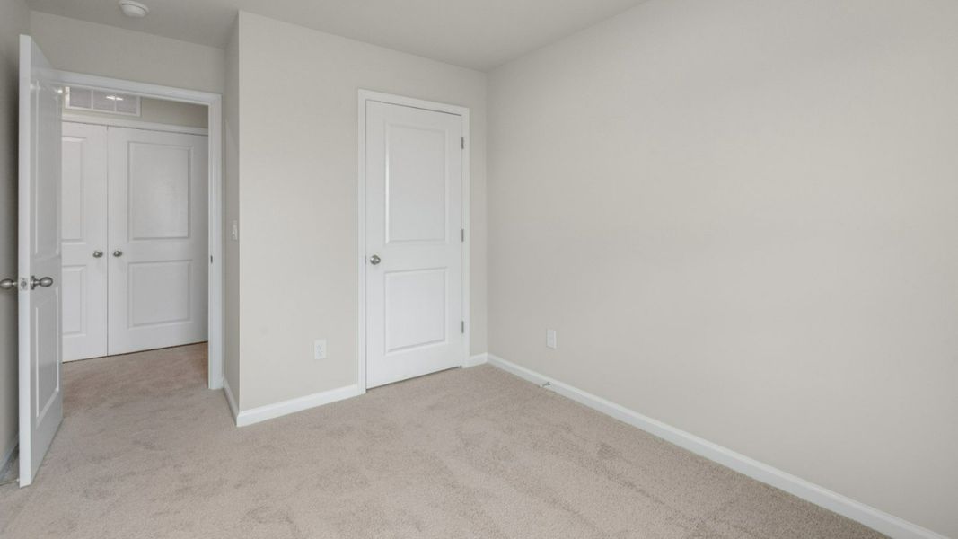 Representative unfurnished interior of a home built from the PEARSON TOWNHOME by D.R. Horton in Grayson Park Townhomes, Leland (Image 27).