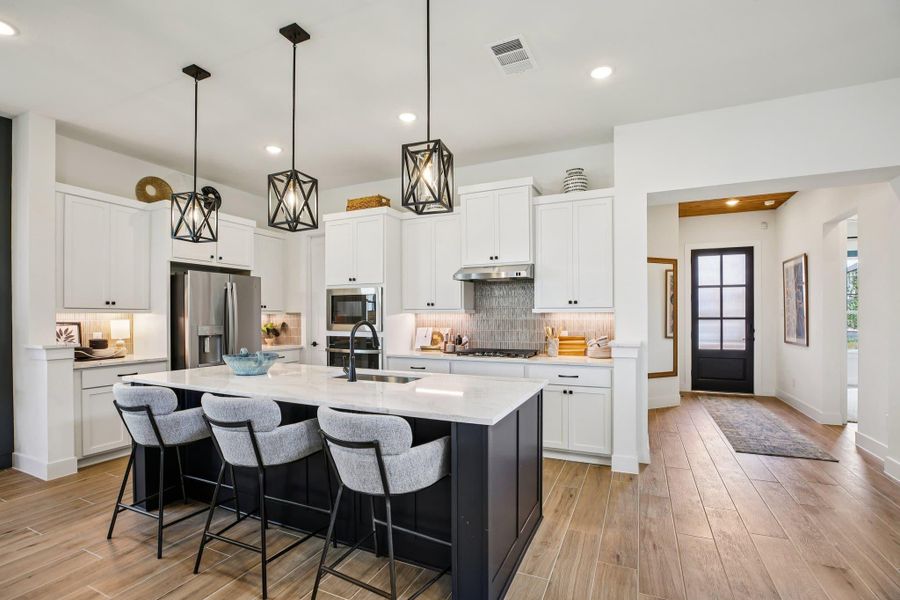 Furnished interior view inside a new home in Bridgeland, Cypress (Image 26).