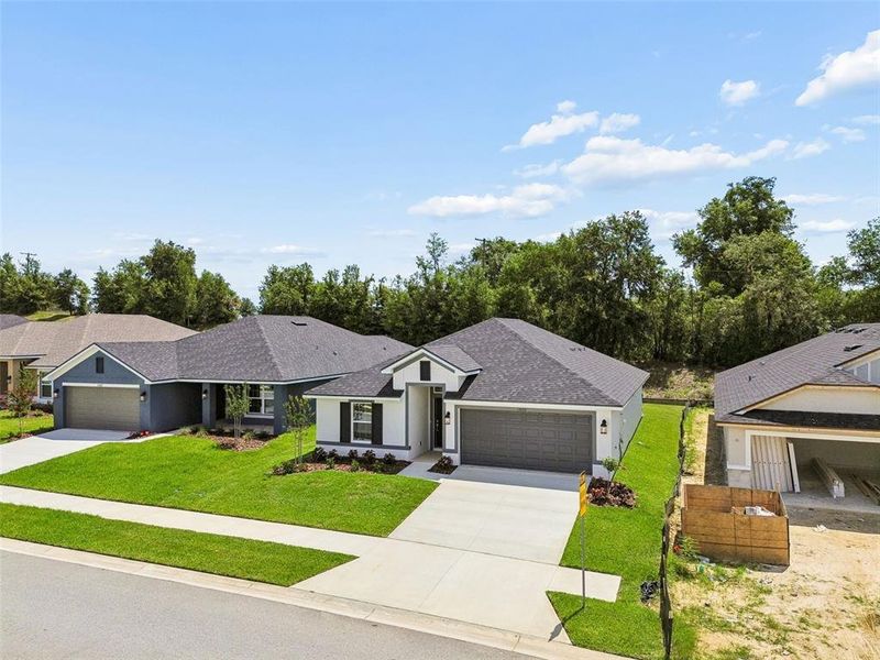 Front exterior of a new home in Abbey Glen, Dade City, FL, highlighting curb appeal (Image 31). Front exterior of a new home in Abbey Glen, Dade City, FL, highlighting curb appeal (Image 31).