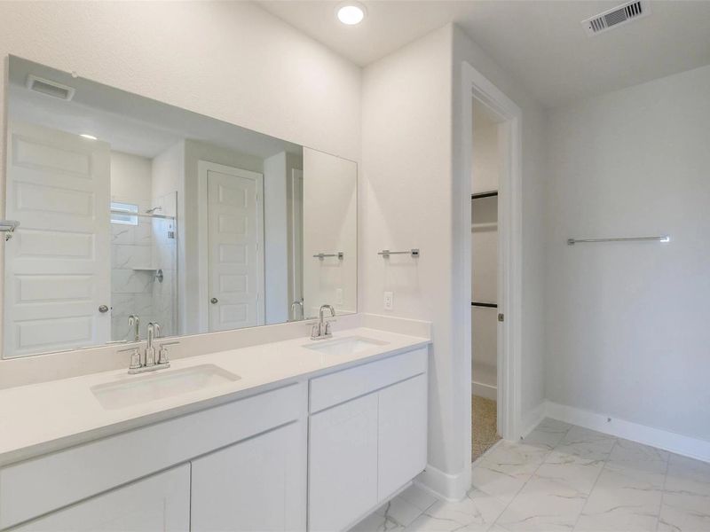 Furnished interior view inside a new home in Sunterra, Katy (Image 7).