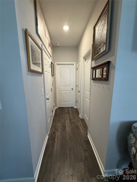 Hall Leading To the 2nd Bedroom, Garage, and Full Bathroom