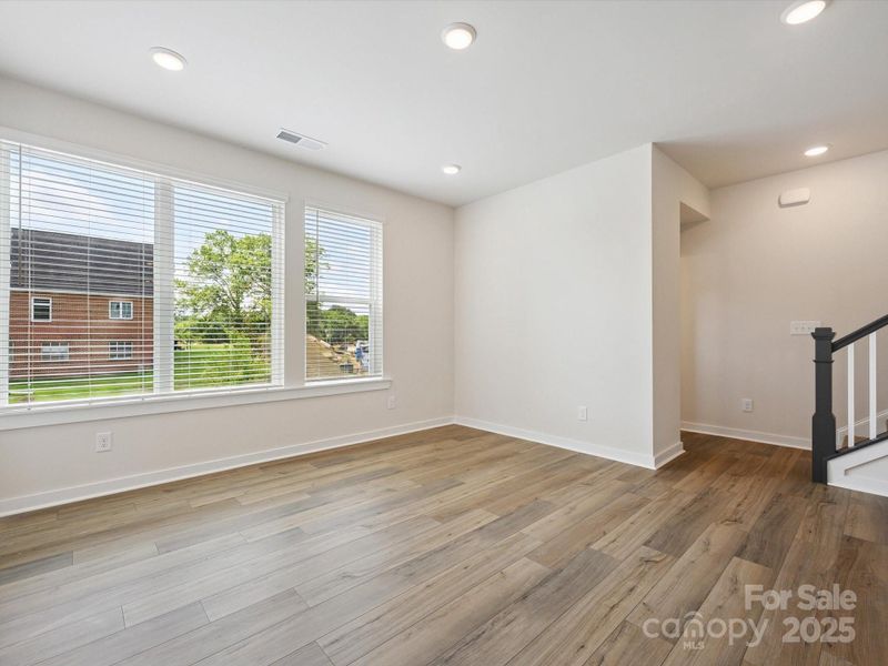 Spacious, unfurnished interior of a new home in Central Living at Craig, Charlotte (Image 25).