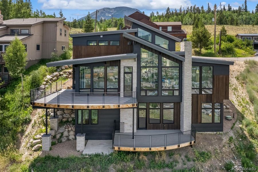 Front exterior of a new home in , Silverthorne, CO, highlighting curb appeal (Image 22).
