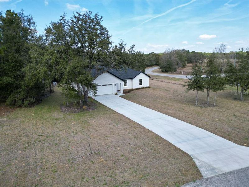 Front exterior of a new home in , Dunnellon, FL, highlighting curb appeal (Image 27).