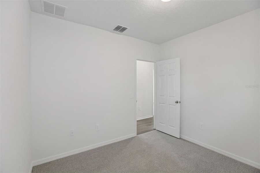 Spacious, unfurnished interior of a new home in Springs at Lake Alfred - Classic Series, Lake Alfred (Image 35).