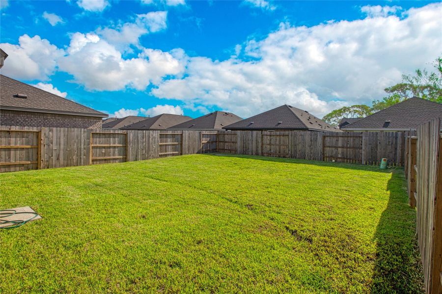 Exterior details and patio area of a home in Sunterra, Katy (Image 3).