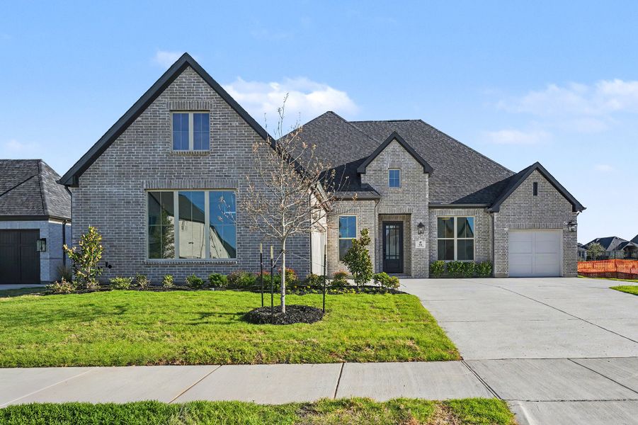 Front exterior of a new home in Quail Hollow, Rockwall, TX, highlighting curb appeal (Image 1). Front exterior of a new home in Quail Hollow, Rockwall, TX, highlighting curb appeal (Image 1).