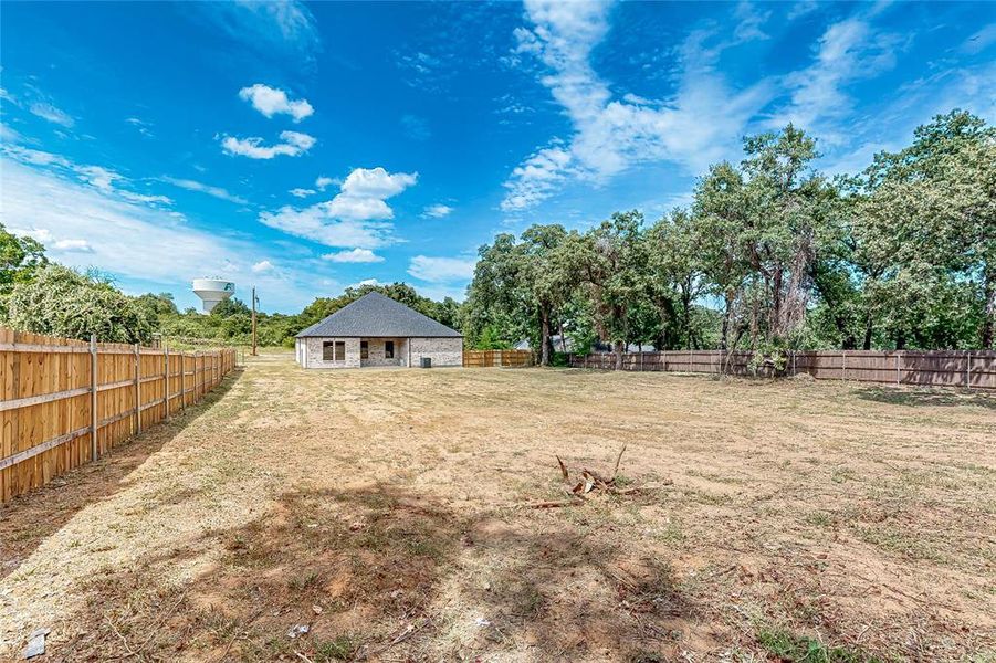 Front exterior of a new home in , Kennedale, TX, highlighting curb appeal (Image 21).