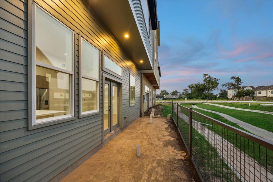 All yards are about 30' wide x 8' deep. Those lots along the dry creek have their own pedestrian gate to the trail.