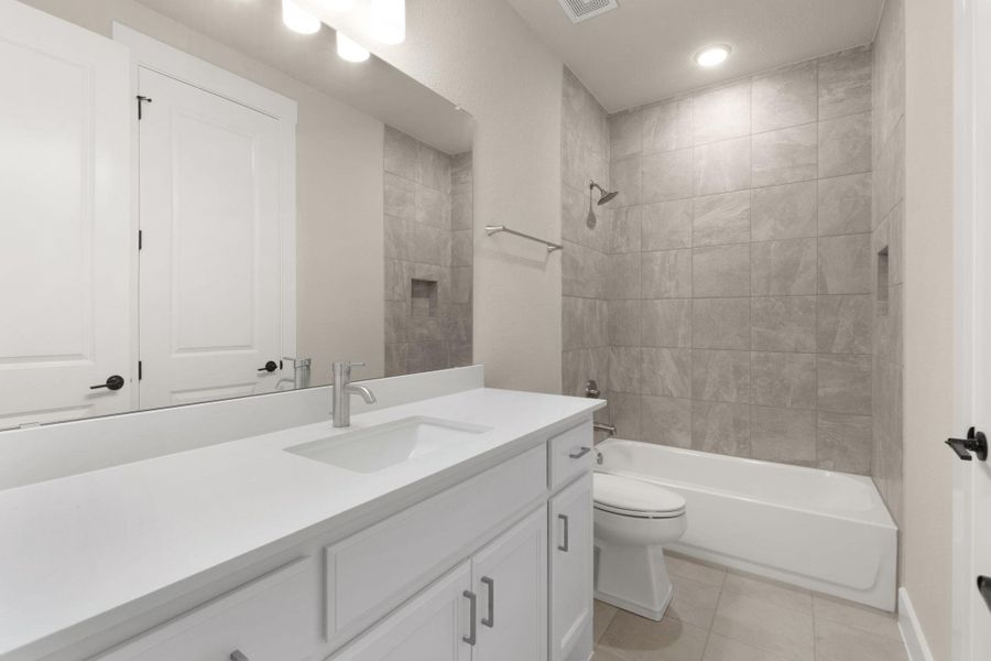 Full bath with vanity, shower / bath combination, light tile patterned flooring, and recessed lighting