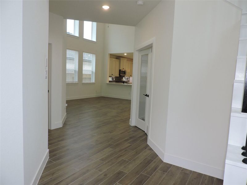 Across from the Home office leads to the garage, and the laundry. The Easy Care Wood Look Ceramic tile flooringis throughout the downstairs.