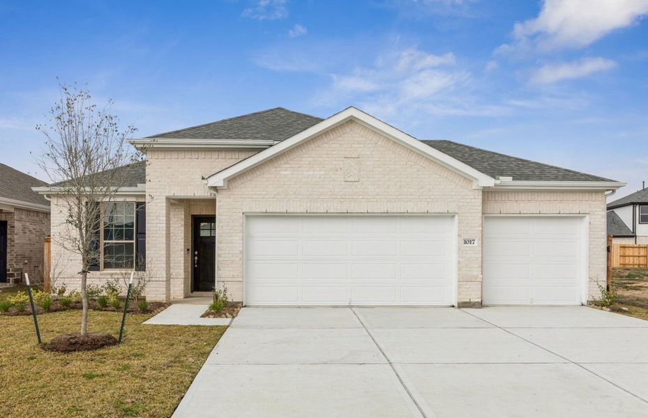 Front exterior of a new home in River Ranch, Dayton, TX, highlighting curb appeal (Image 2). Front exterior of a new home in River Ranch, Dayton, TX, highlighting curb appeal (Image 2).