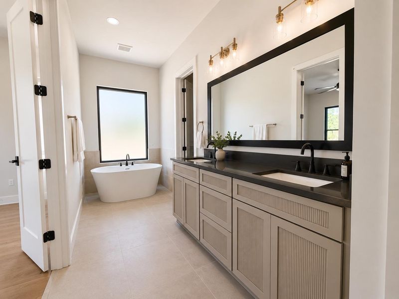 A spacious primary bathroom boasts a freestanding soaking tub and a generous double vanity with a large mirror.