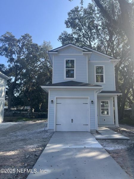 Front exterior of a new home in , Jacksonville, FL, highlighting curb appeal (Image 1). Front exterior of a new home in , Jacksonville, FL, highlighting curb appeal (Image 1).