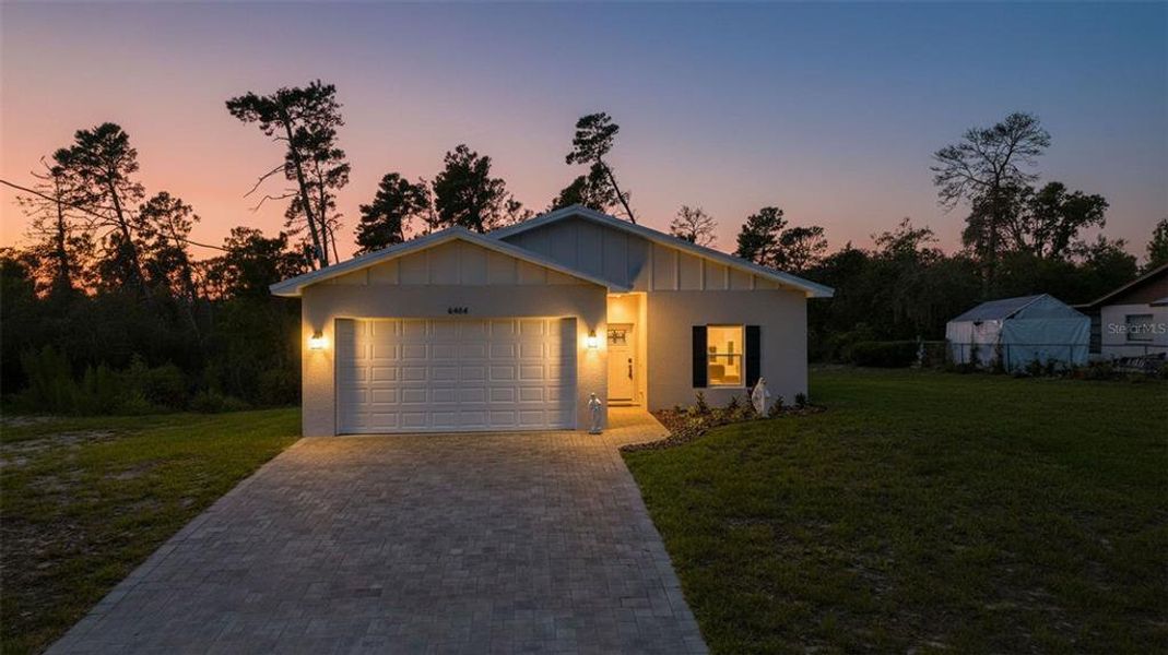Front exterior of a new home in , Spring Hill, FL, highlighting curb appeal (Image 24).