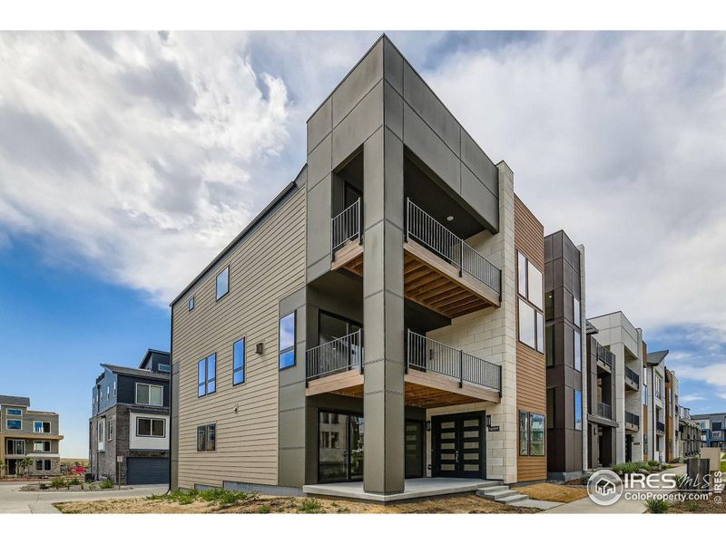 Front exterior of a new home in Baseline, Broomfield, CO, highlighting curb appeal (Image 1).