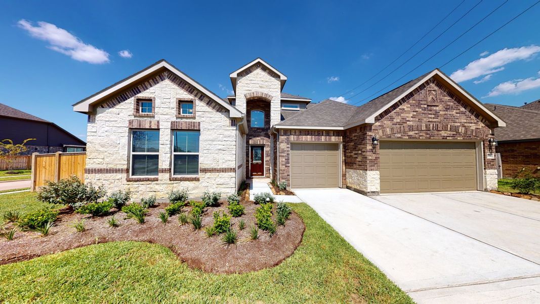 Representative exterior photo of a completed home built from the Floor Plan 3256 by Colina Homes in Grand Magnolia, Magnolia, TX (Image 28).