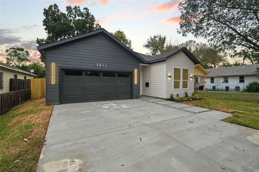 Front exterior of a new home in , Dallas, TX, highlighting curb appeal (Image 19).