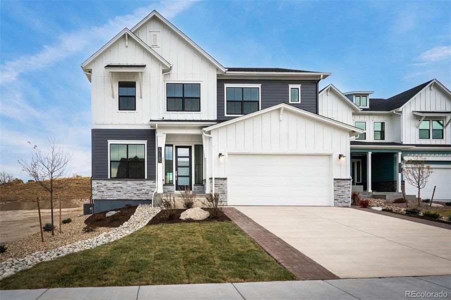 Front exterior of a new home in Cloverleaf – Mountainview Collection, Monument, CO, highlighting curb appeal (Image 1).