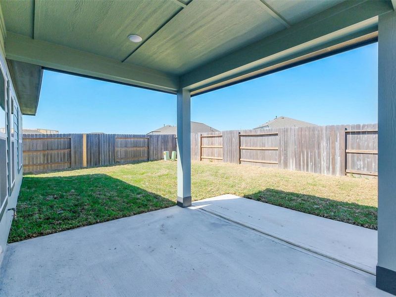 Exterior details and patio area of a home in Sunterra, Katy (Image 4).