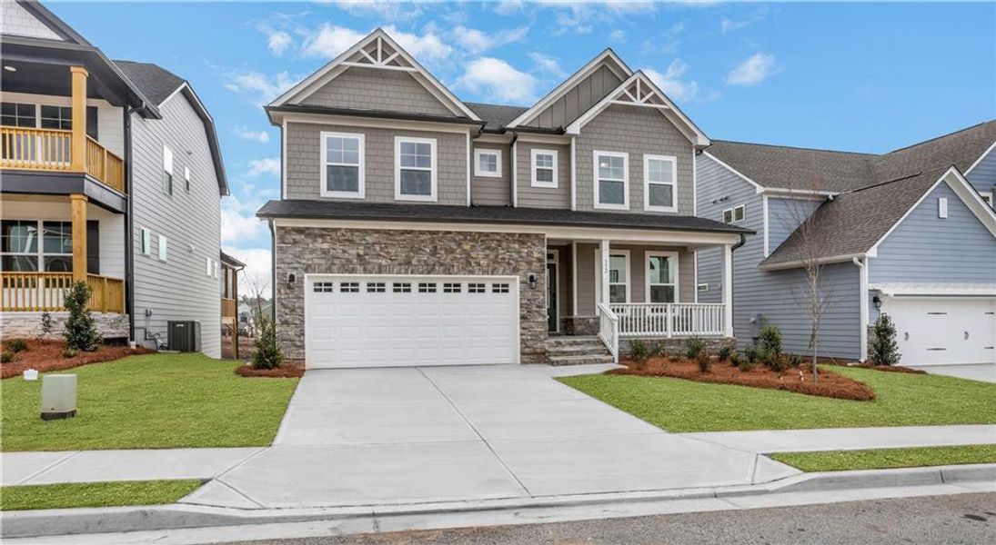 Front exterior of a new home in Twin Lakes, Hoschton, GA, highlighting curb appeal (Image 24). Front exterior of a new home in Twin Lakes, Hoschton, GA, highlighting curb appeal (Image 24).