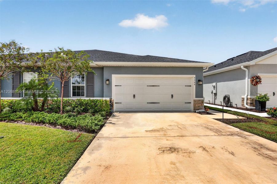 Front exterior of a new home in , Port St. Lucie, FL, highlighting curb appeal (Image 2). Front exterior of a new home in , Port St. Lucie, FL, highlighting curb appeal (Image 2).