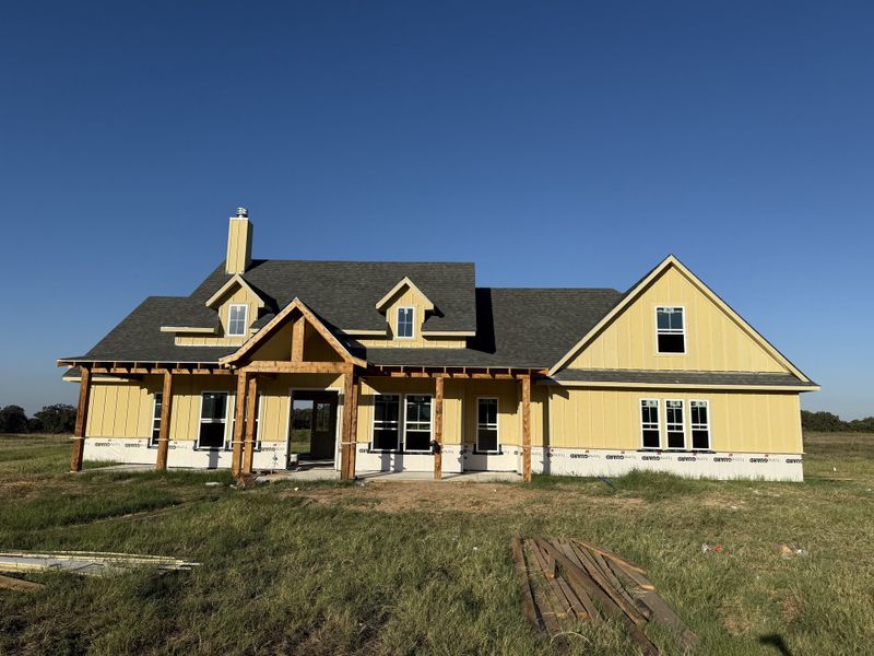 Front exterior of a new home in Oak Water Ranch, Granbury, TX, highlighting curb appeal (Image 1).