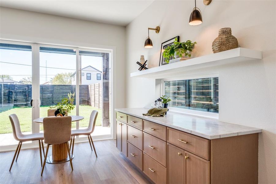 Dining space with plenty of natural light and light wood-type flooring