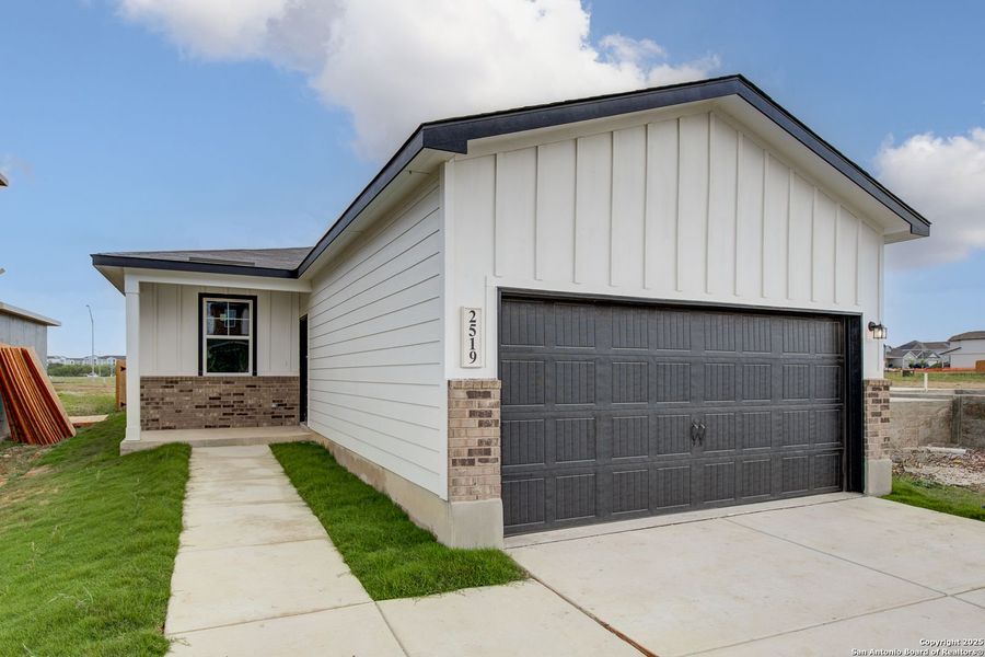 Front exterior of a new home in Applewhite Meadows, San Antonio, TX, highlighting curb appeal (Image 8).